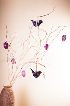 Handmade easter decorations on the branches in vase