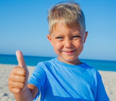 Portrait of adorable cute boy on beach vacation