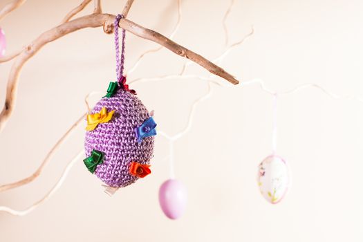 Handmade crochet easter decorations on the branches in vase
