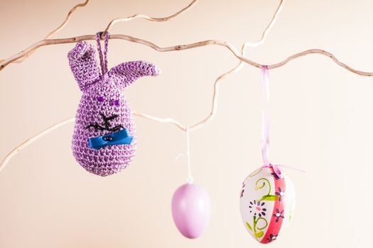 Handmade crochet easter decorations on the branches in vase