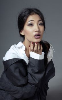 Sad Asian actress playing her role in the studio