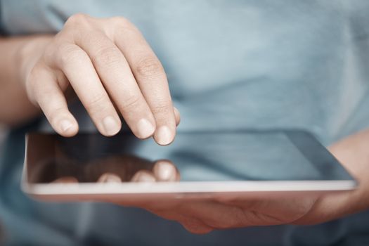 Human hands working with digital tablet