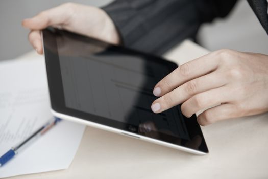 Businesswoman at office working with digital PC