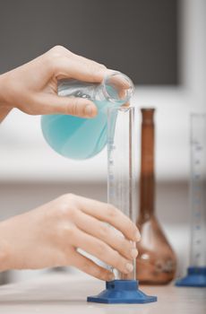 Human hands working in chemical laboratory