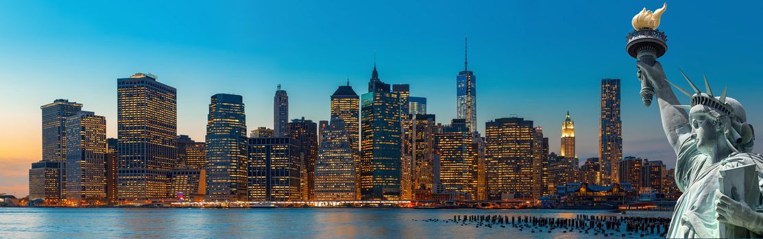 Evening New York City skyline panorama and The Statue of Liberty