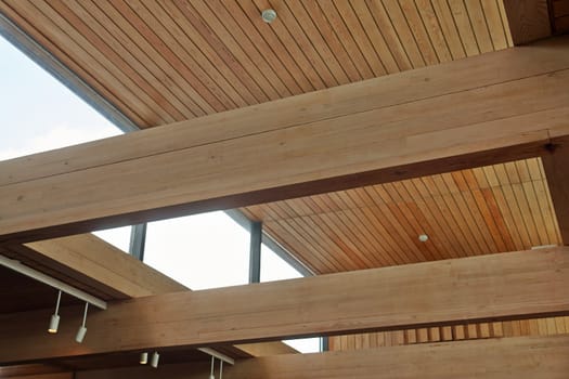 Massive wood beams inside a modern design building office                               