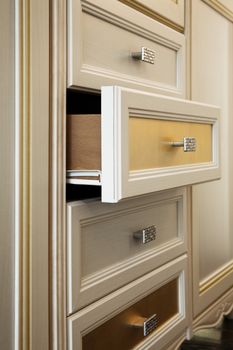 beautiful cabinet with drawers in a modern room