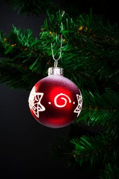 red ball on the artificial Christmas tree