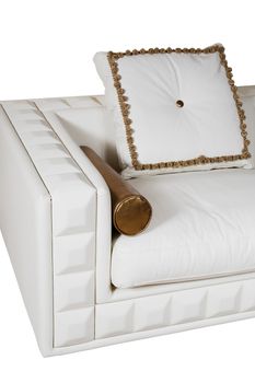 Fashionable leather white sofa with a beautiful cushion