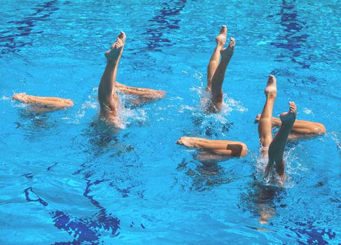 Synchronized swimmers legs movement