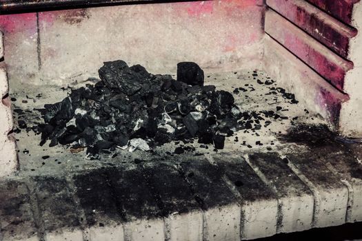 ash wood in fireplace brick