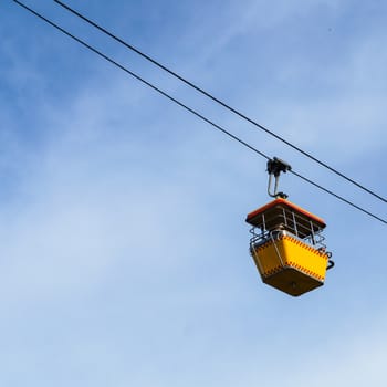 Cable car on the blue sky background