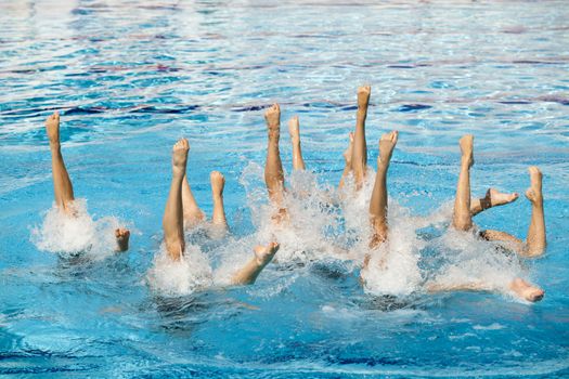 Synchronized swimmers legs movement