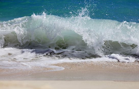 Big wave crashes on to the shore. Atlantic Ocean