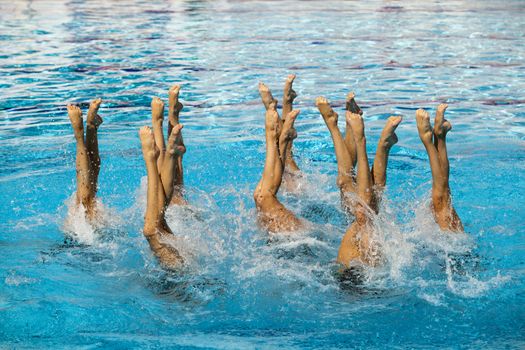 Synchronized swimmers legs movement