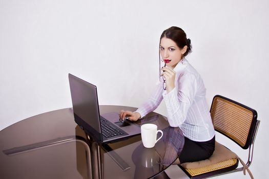 portrait of young businesswoman sitting at desk