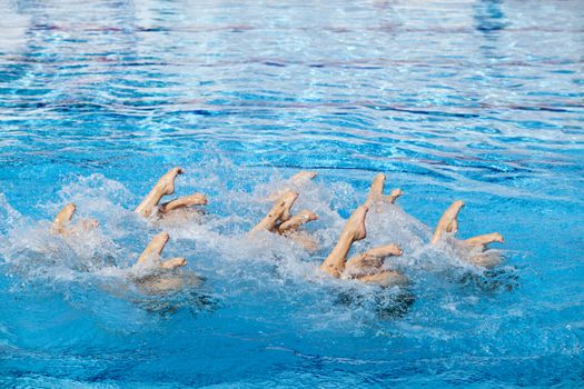 Synchronized swimmers legs movement