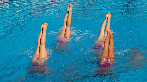 Synchronized swimmers legs movement