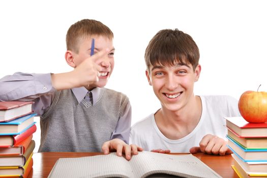 Cheerful Older and Little Brothers doing homework together Isolated on the White Background
