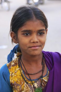 Indian girl walking in the street of old town, Bundi, Rajasthan, India