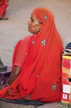 Indian woman sittingat the market, Old town of Bundi, Rajasthan, India