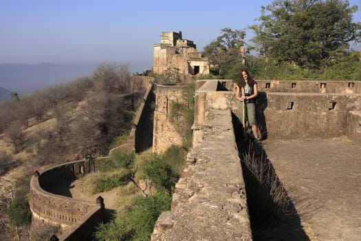 Young woman standing at Taragarh Fort, Bundi, Rajasthan, India