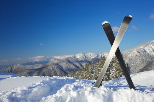 Winter vacation. Ski in the snow mountains.