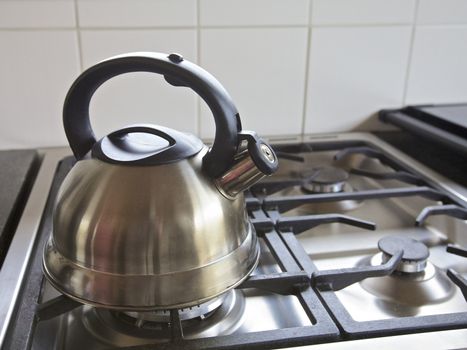 Kettle on a gas stove int a kitchen, home