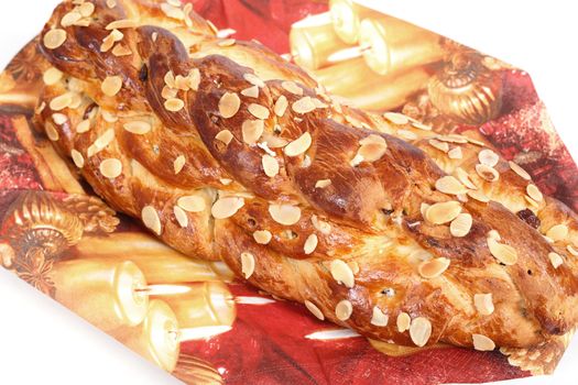 detail of christmas cake with almonds on white background