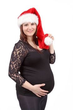 beautiful smiling pregnant santa woman tenderly holding her tummy isolated on white background