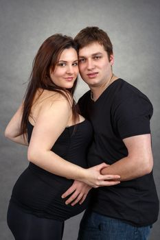 Loving happy couple, pregnant woman with her husband