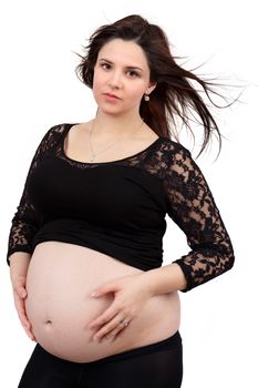 beautiful smiling pregnant woman tenderly holding her tummy isolated on white background