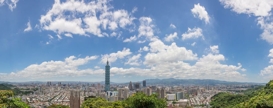 Cityscape of Taipei with skyscraper under dramatic clouds at blue sky in Taiwan, Asia.