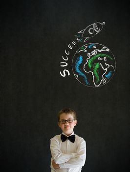 Thinking boy dressed up as business man with chalk globe and jet world travel on blackboard background