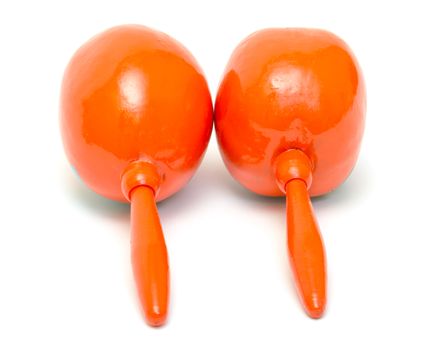 Orange maracas on white background