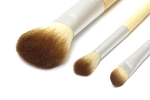 Makeup brushes on white background
