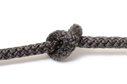 Black rope knot on white background