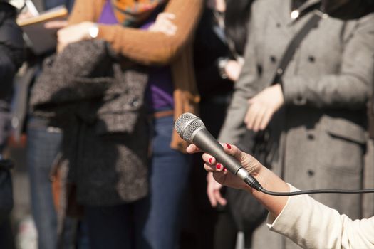 Microphone in woman's hand