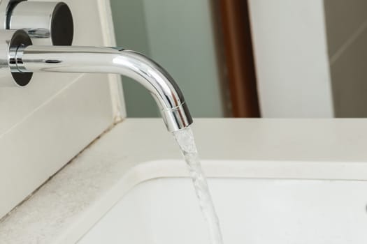 Water tap with flowing water
