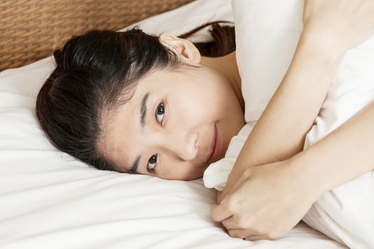 young beautiful woman sleeping in bed, in morning