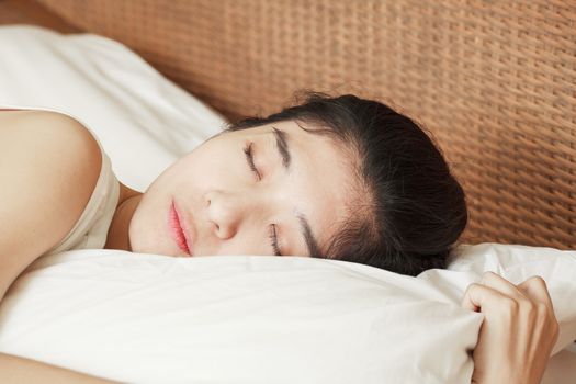 young beautiful woman sleeping in bed