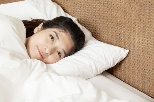 young beautiful woman sleeping and smile in morning