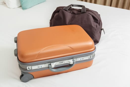 business suitcase on bed for traveling