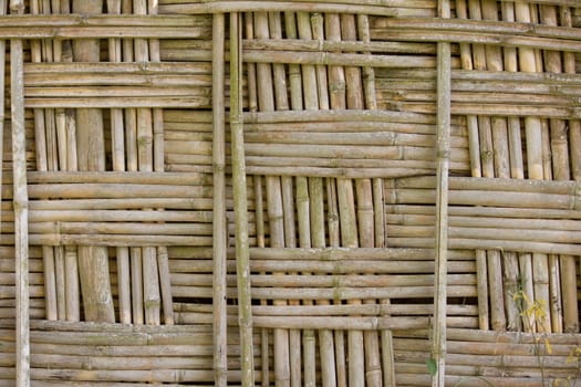 a fence made of bamboo in an African village