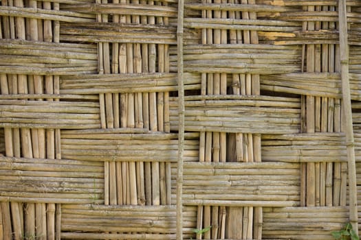 a fence made of bamboo in an African village