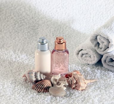 Bottle with massage oil on a background of towel
