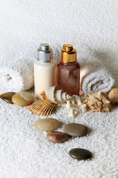 Bottle with massage oil on a background of towel