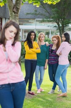 Female student being bullied by other group of students