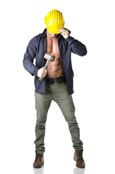 Attractive, muscular construction worker with open sweatshirt and hammer, wearing yellow hard hat, isolated on white