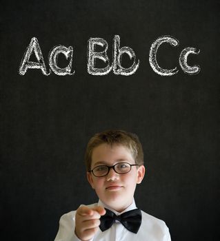 Education needs you thinking boy dressed up as business man with learn English language alphabet on blackboard background